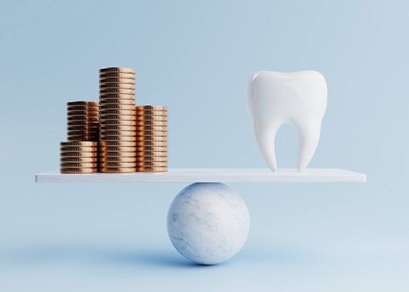 Stacks of coins balanced against tooth