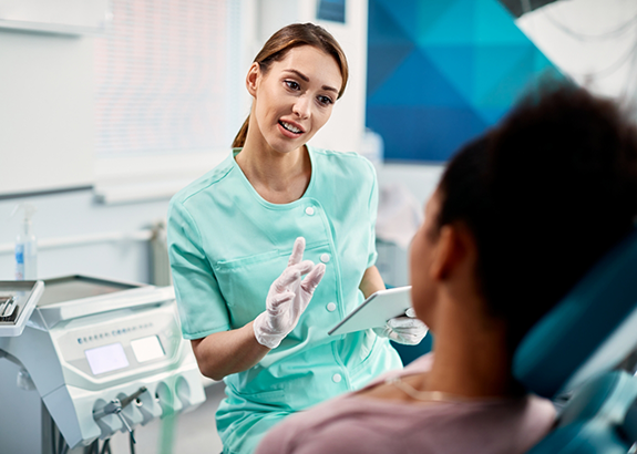 Dentist explaining a treatment to a patient