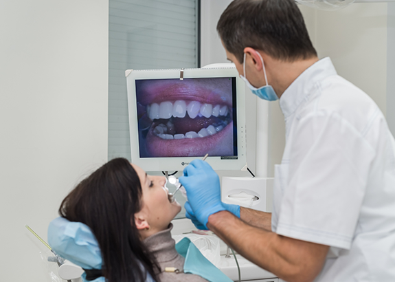 Dentist capturing close up photos of a patients teeth