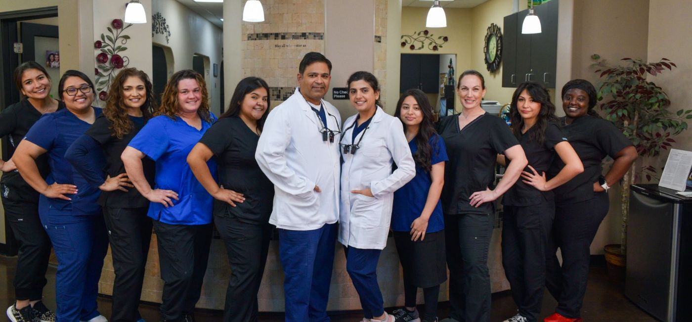Brenham dentists and team members standing in dental office