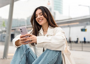 Lady reads something on her phone