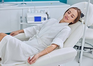Patient relaxing as IV sedation effects take hold