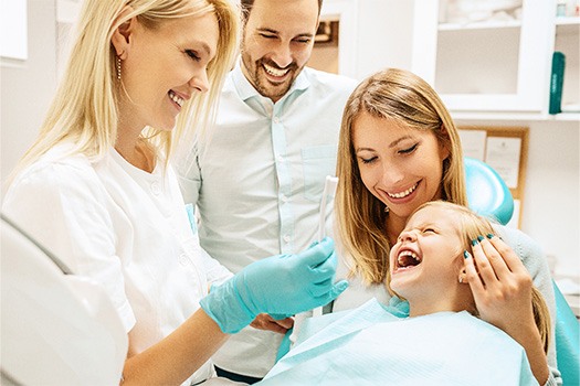 Young patient in Bellville smiling in the dentist chair