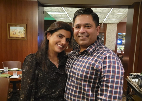 Doctor Sharma smiling with his wife