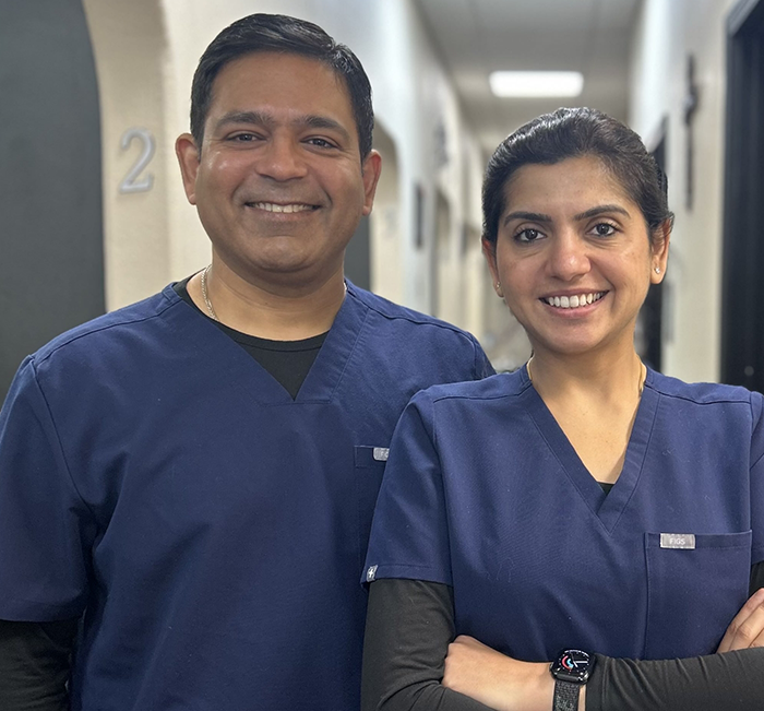 Brenham dentists Doctor Sumeet Sharma and Doctor Saru Sharma smiling