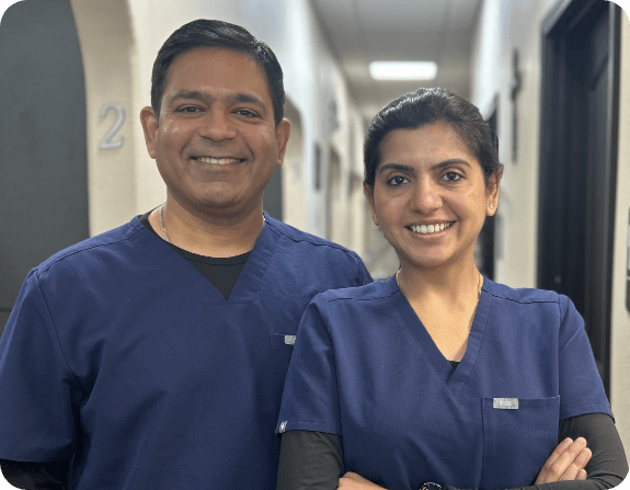 smiling Drs. Sumeet and Saru Sharma