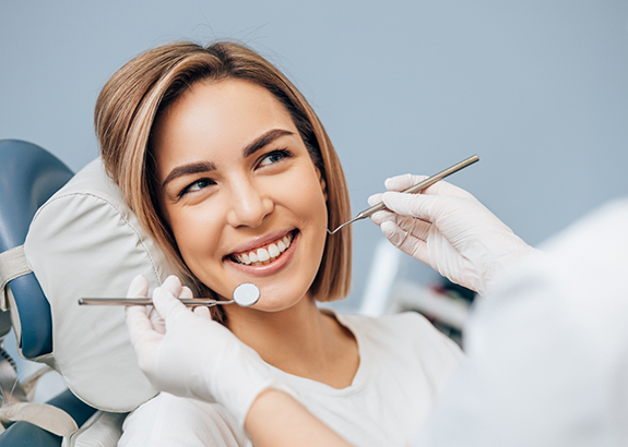 Woman smiling at her dentist during a dental checkup