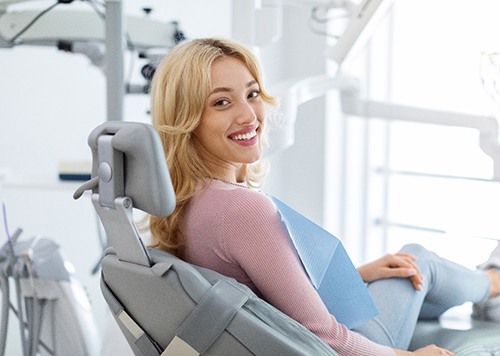 Closeup of smiling patient sitting in treatment chair