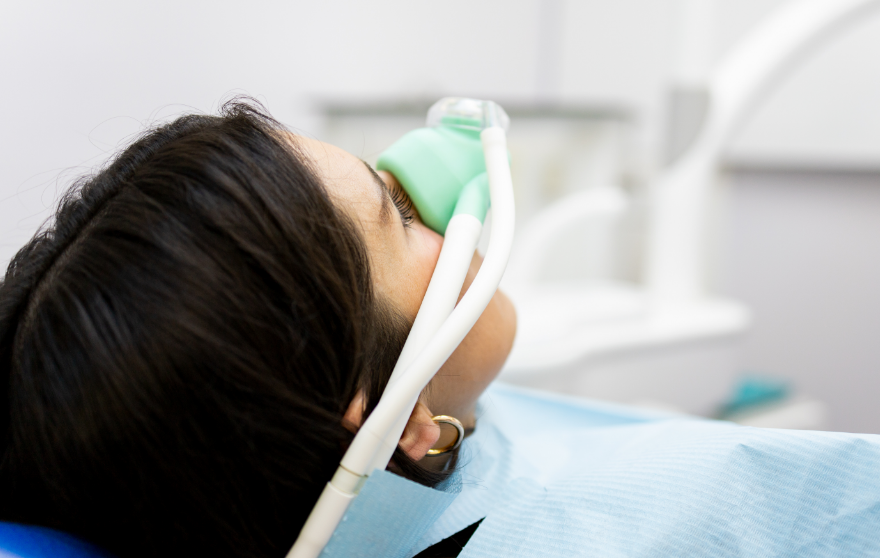 Woman with nitrous oxide mask