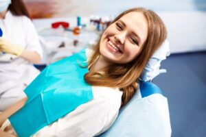 Woman smiling after her treatment with conscious sedation