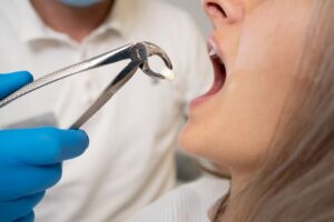 Woman getting a tooth extraction